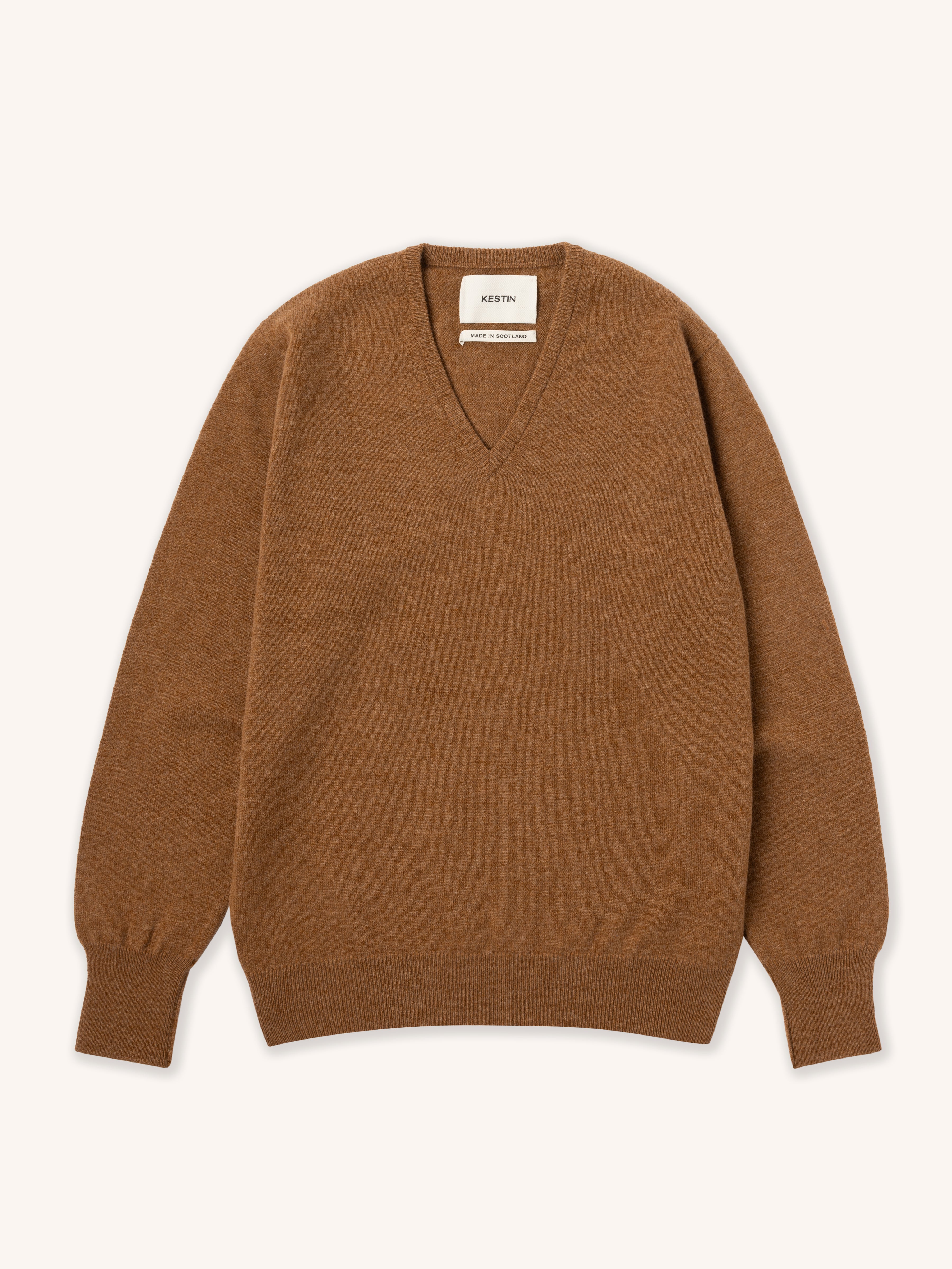 Brown v neck sweater on a white background