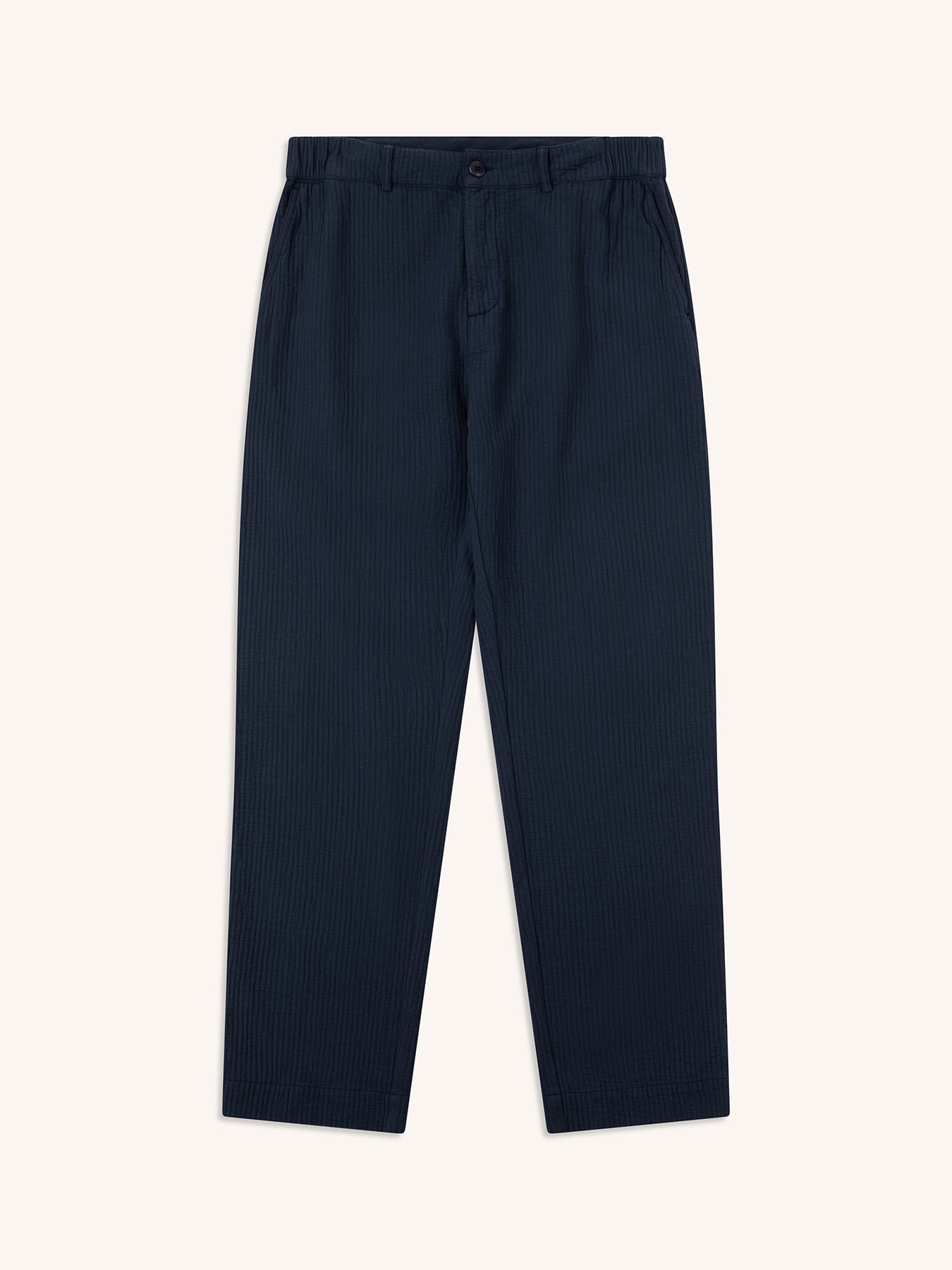 A pair of navy blue trousers from designer brand KESTIN, on a white background.