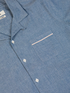 A close-up of the KESTIN Crammond Shirt in a blue chambray fabric.
