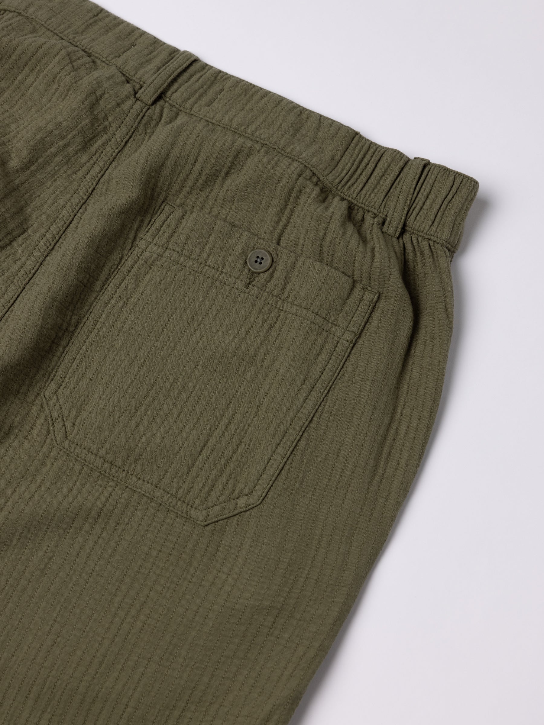 The rear pocket and elasticated waistband of the Aberlour Pant in Olive Green.