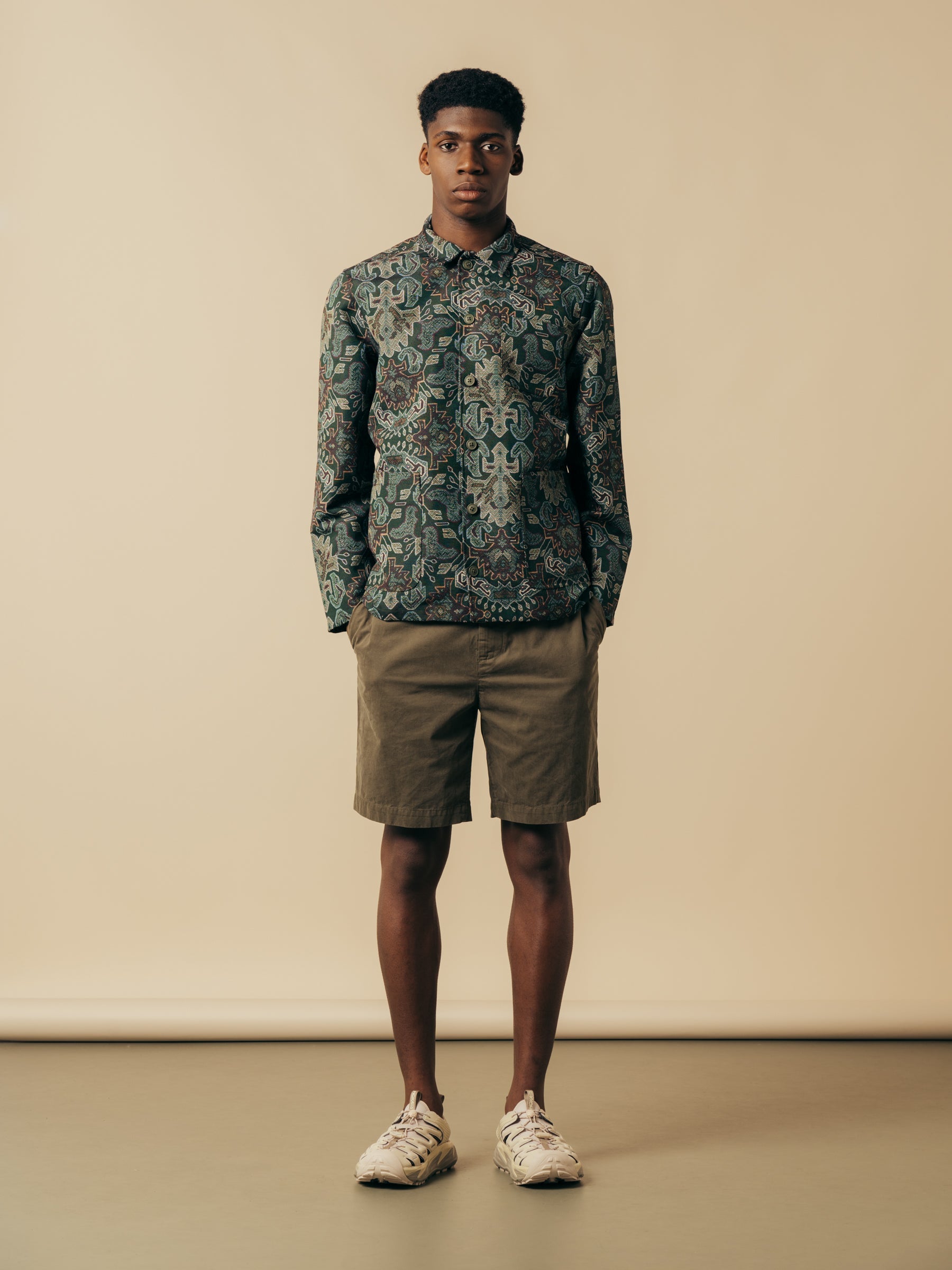 A model wearing a pair of shorts and a jacket from menswear brand KESTIN.