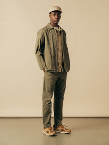 A model wearing an olive green outfit from Scottish menswear brand KESTIN.
