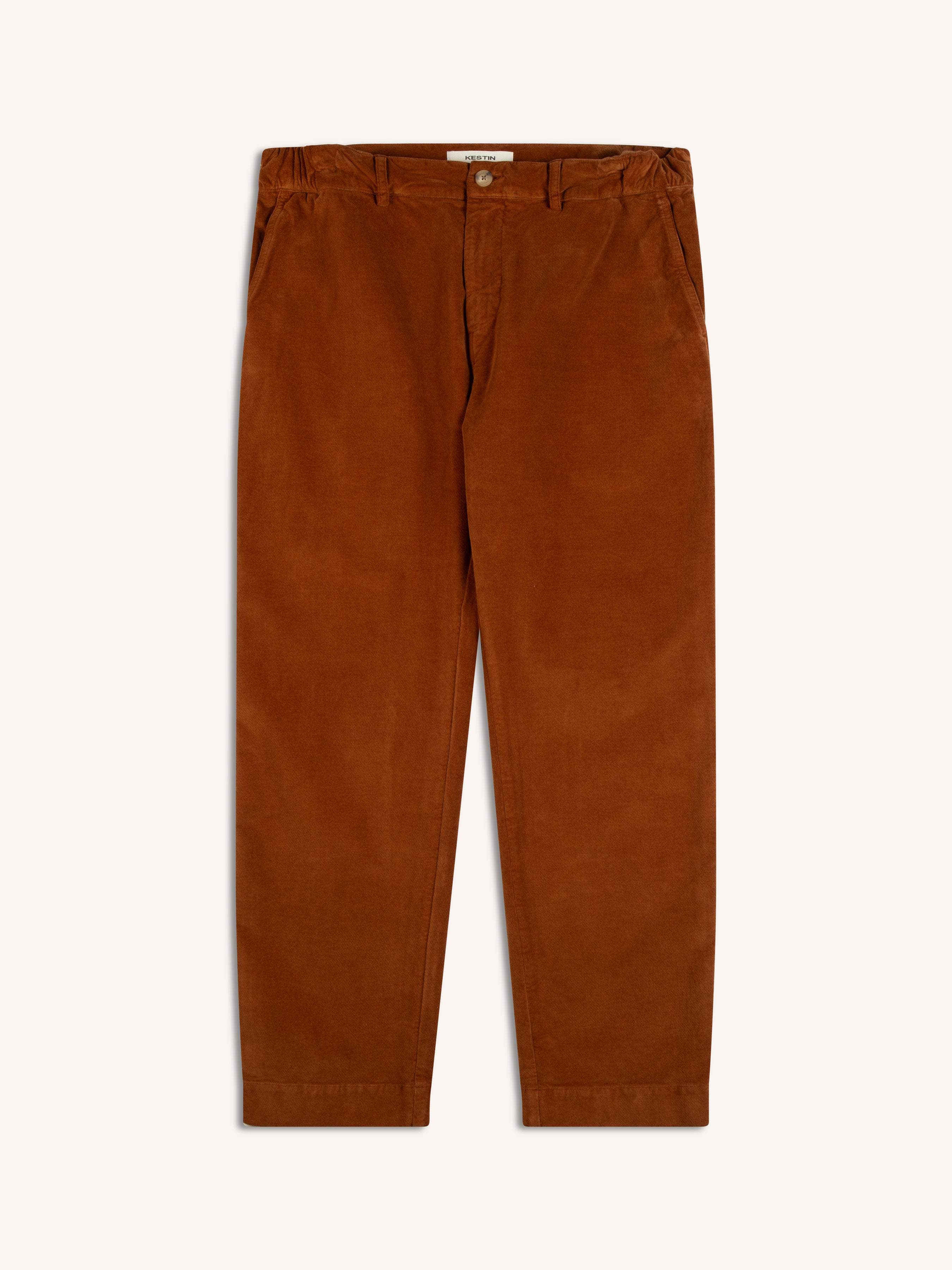 A pair of men's brown moleskin trousers on a white background.