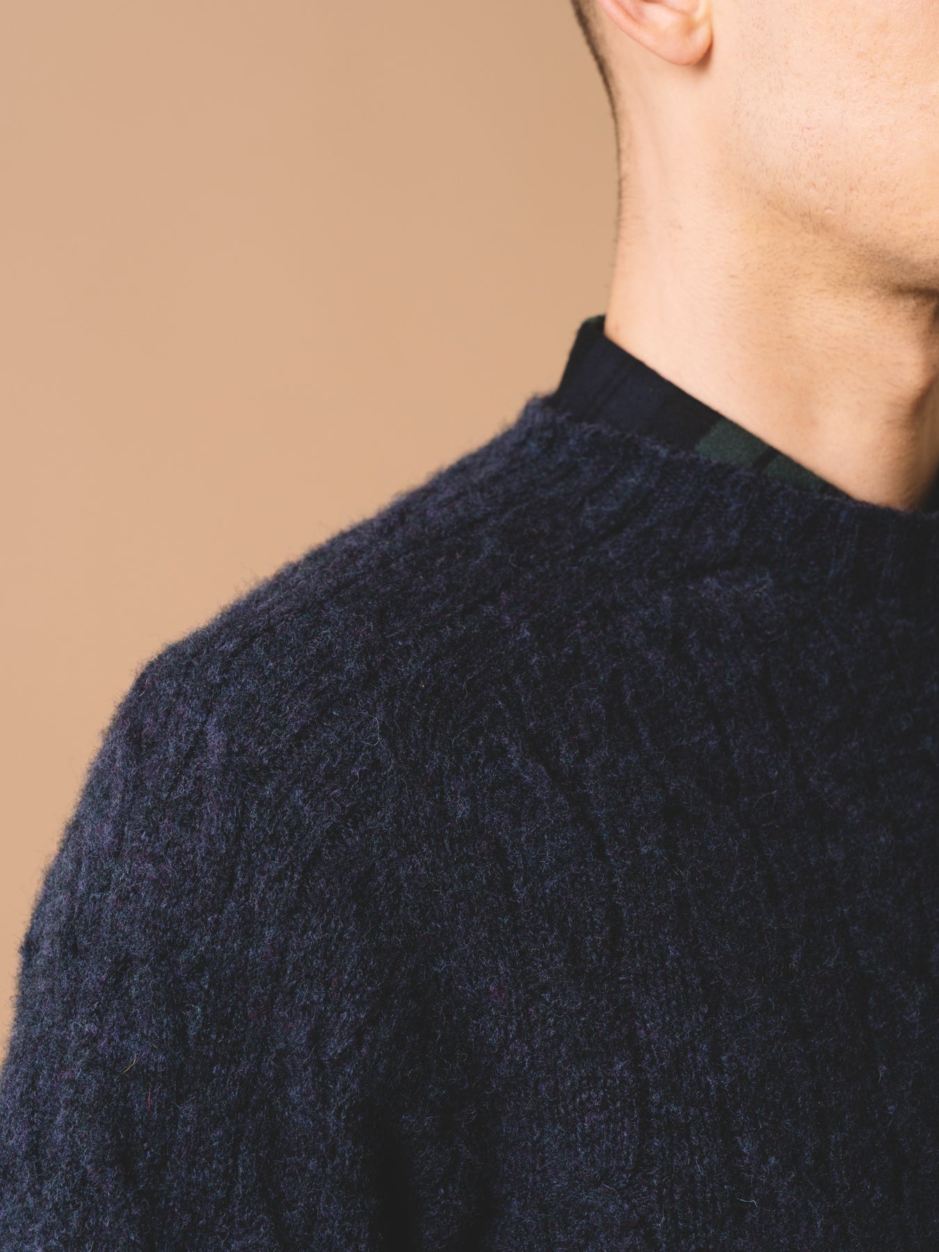 The shoulder and collar of the KESTIN Galloway Knit Sweater in Airforce Blue.