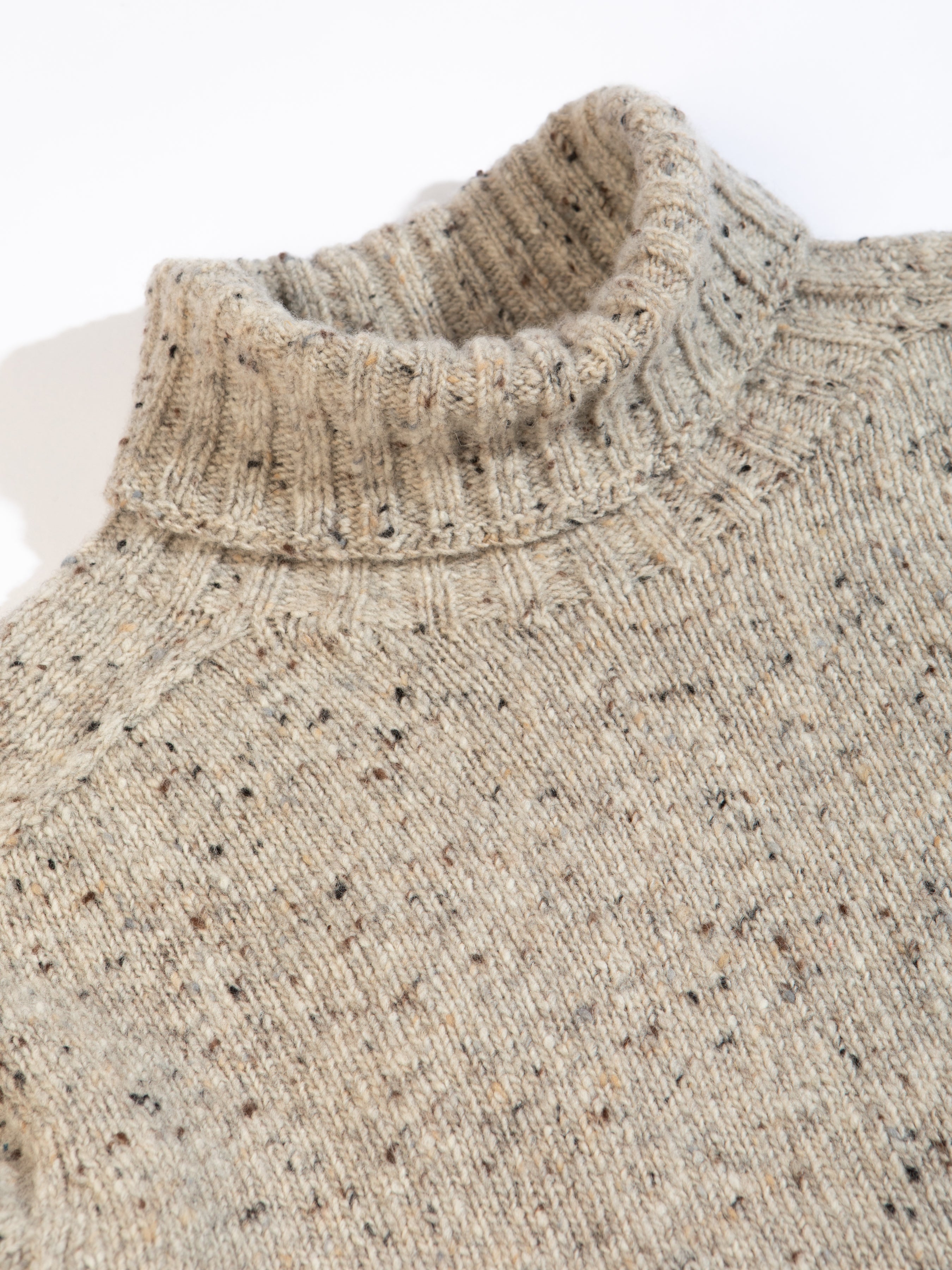 A knitted roll neck sweater from men's clothing brand KESTIN, on a white background.