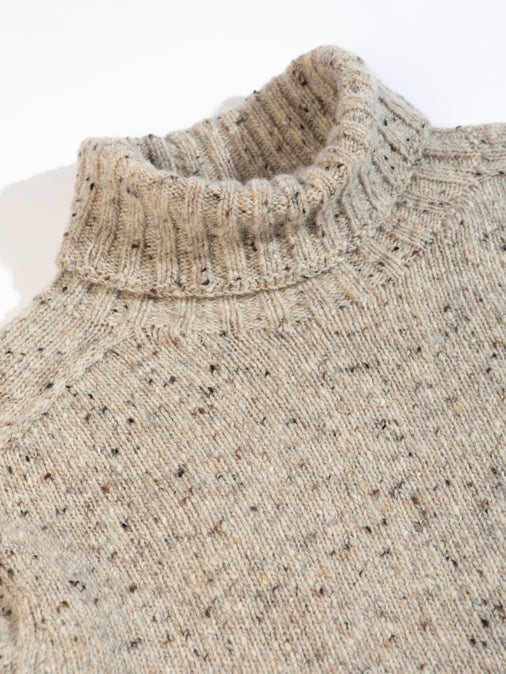 A knitted roll neck sweater from men's clothing brand KESTIN, on a white background.