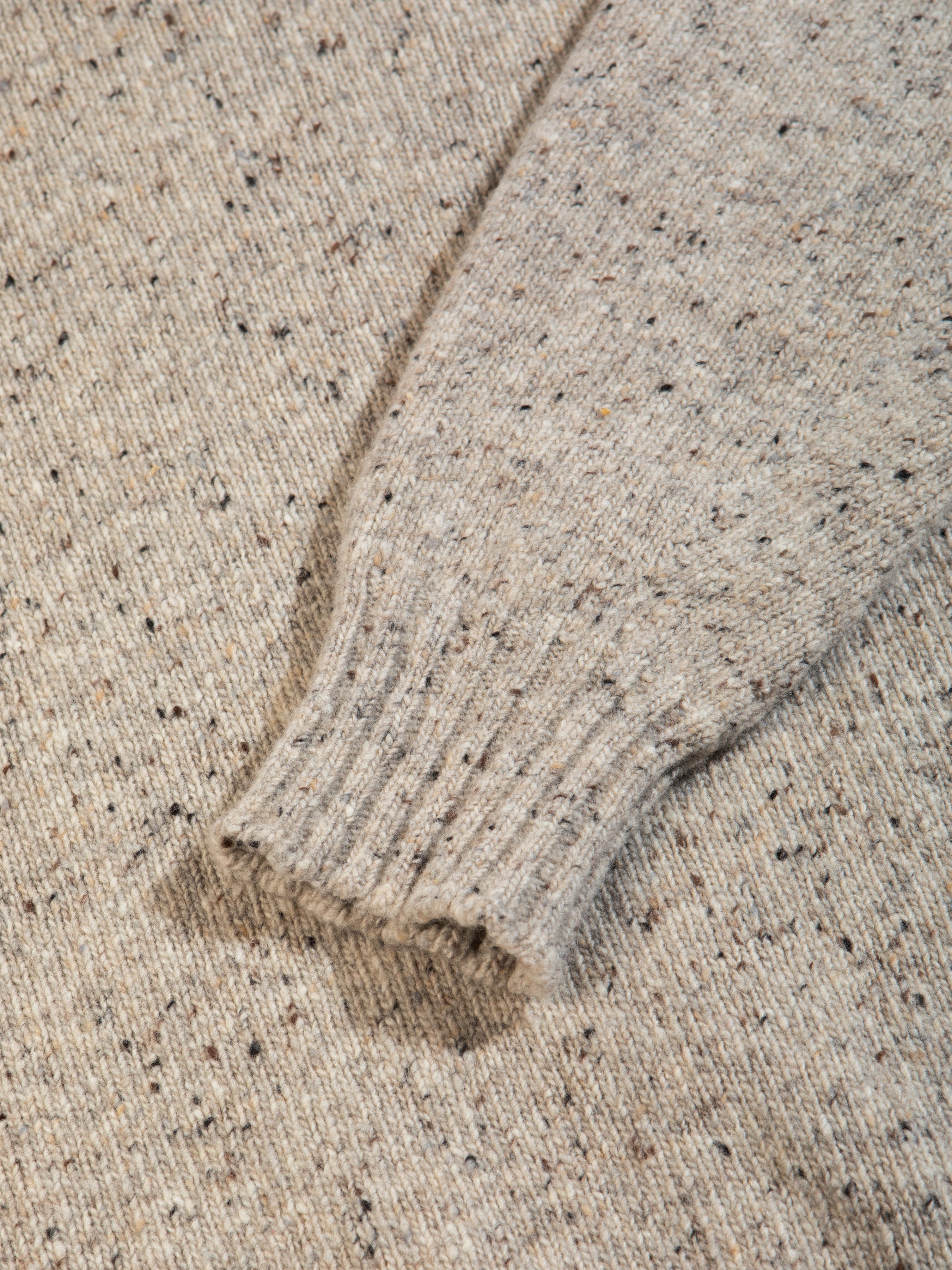 The ribbed cuff to a Made In Scotland sweater, made from Donegal wool.
