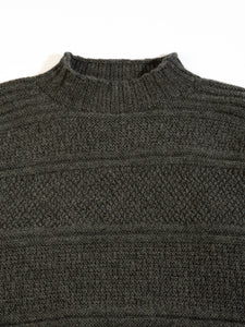 A charcoal grey sweater from menswear brand KESTIN, made in Scotland from merino wool.