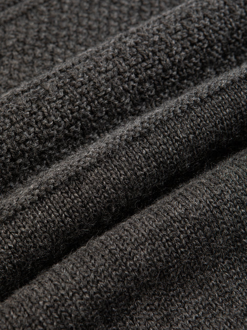 A charcoal grey merino wool material, knitted in Scotland.