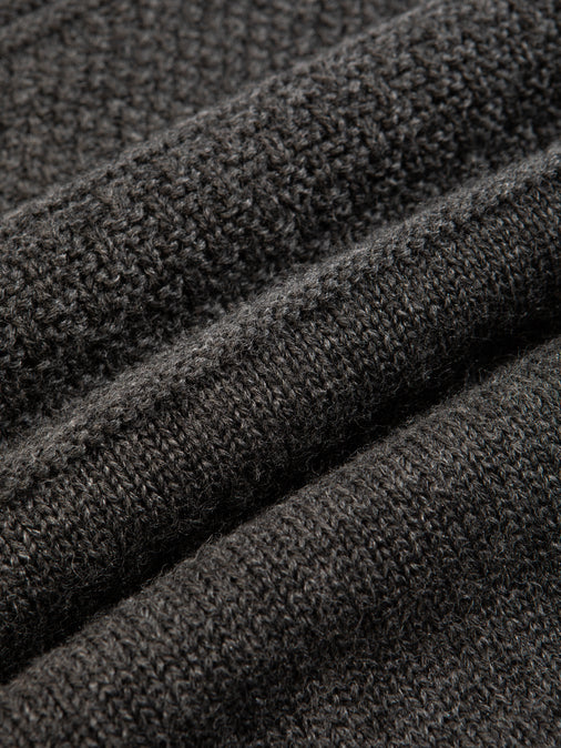 A charcoal grey merino wool material, knitted in Scotland.