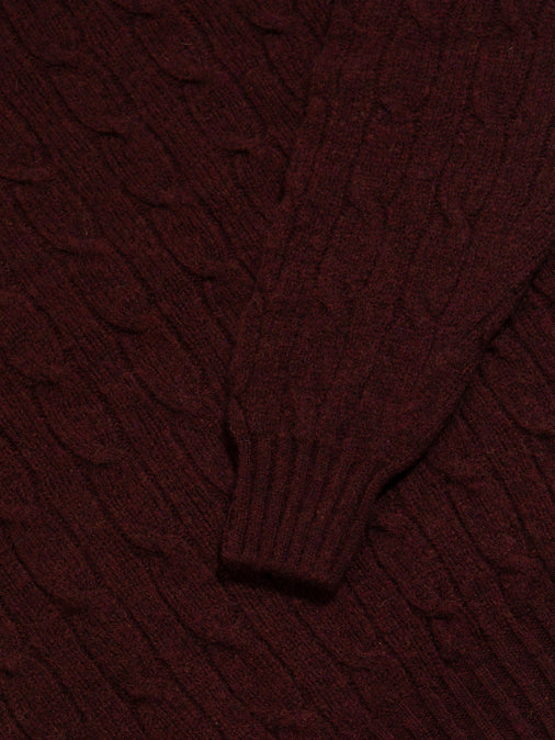 The ribbed cuff and cable-knit body of the Galloway Sweater by menswear brand KESTIN.
