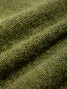 A brushed Shetland wool material in a green colour.