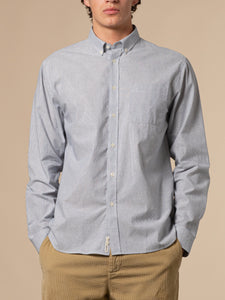 A model wearing the KESTIN Raeburn Oxford Shirt in a blue and white stripe.