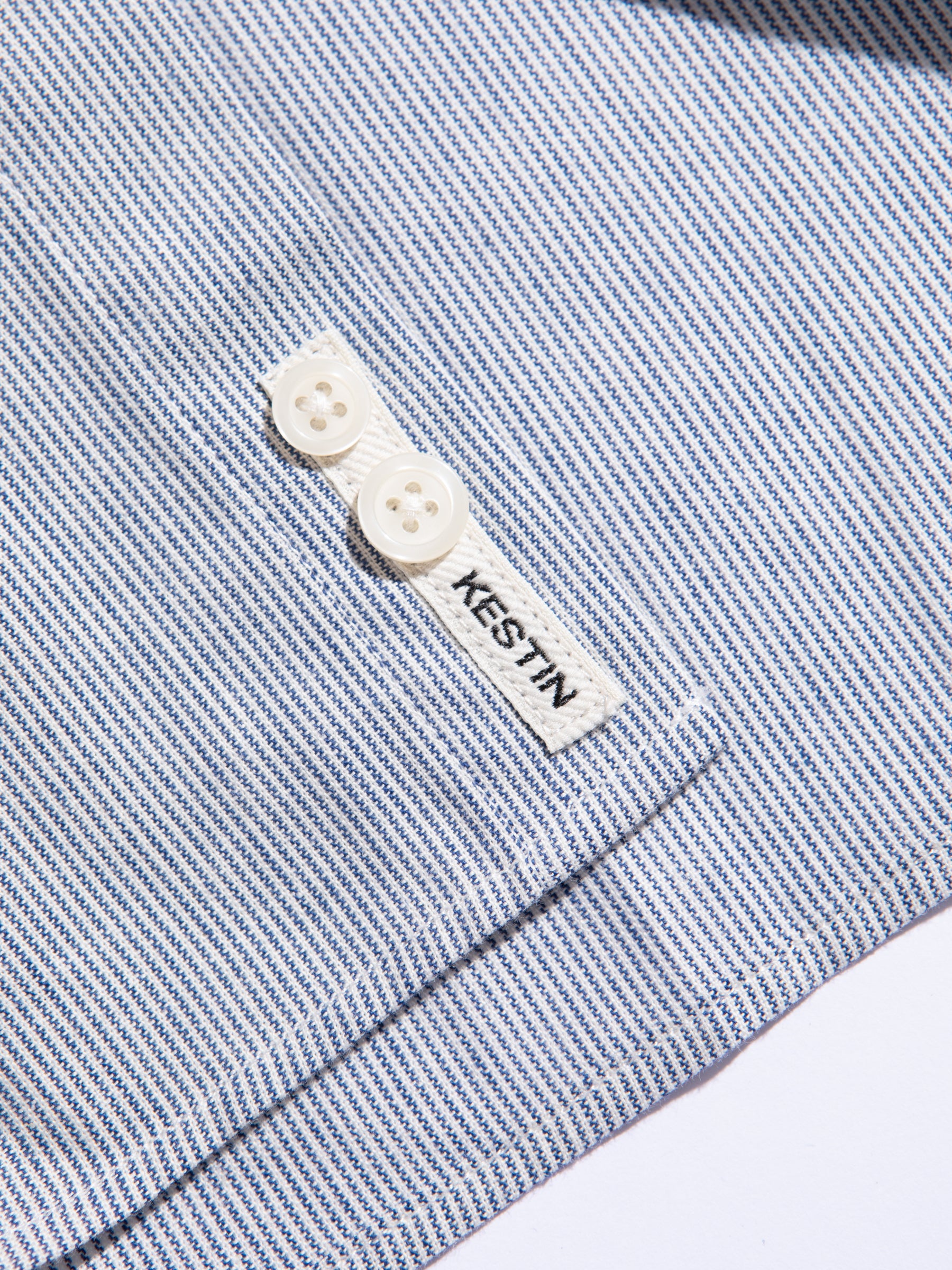 A fine blue and white stripe, used for the AW23 Raeburn Shirt by KESTIN.