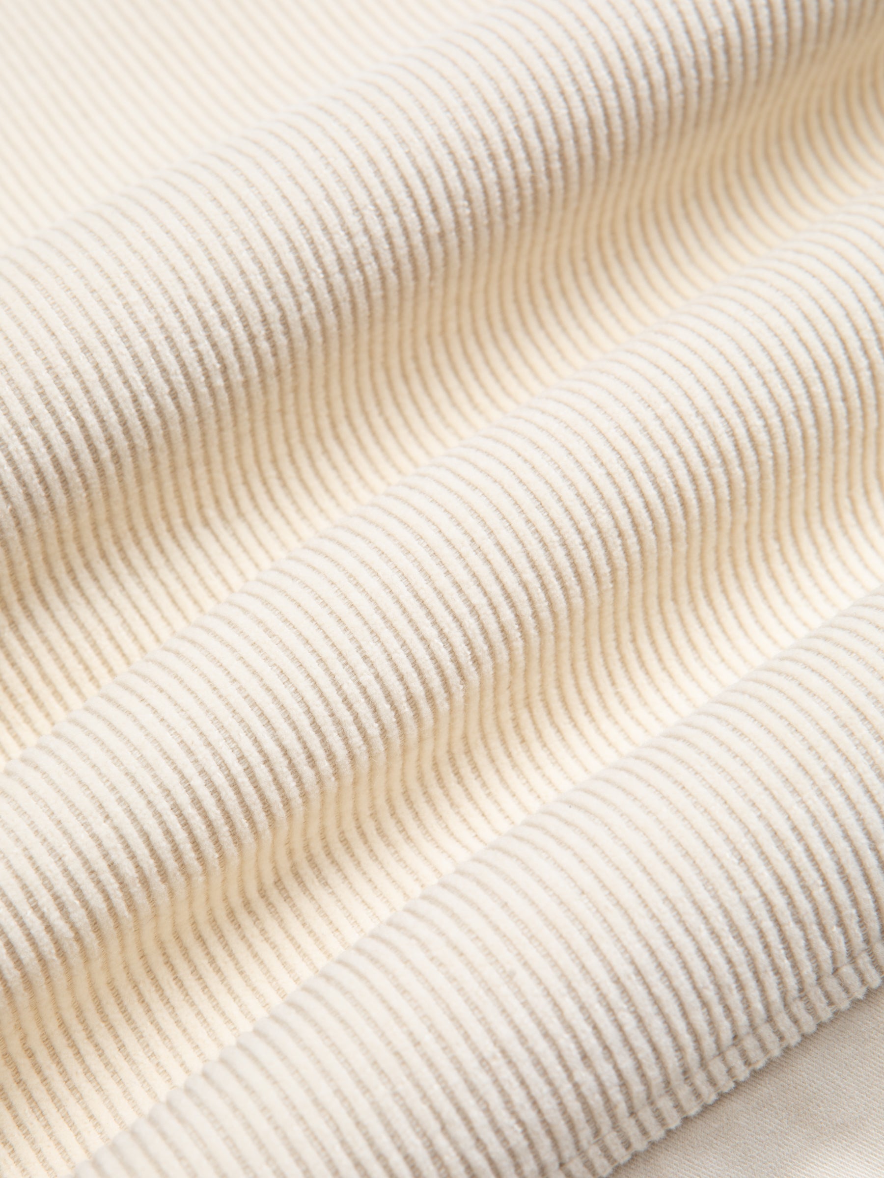 A corduroy fabric in an off white / cream colour, used by menswear brand KESTIN.