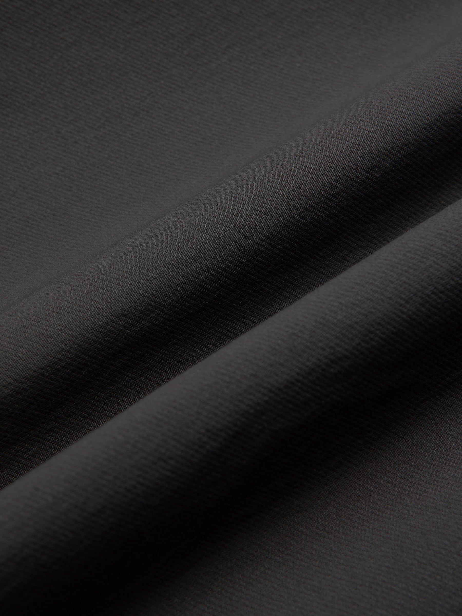 A grey technical Japanese fabric used to make a premium suit by menswear brand KESTIN.
