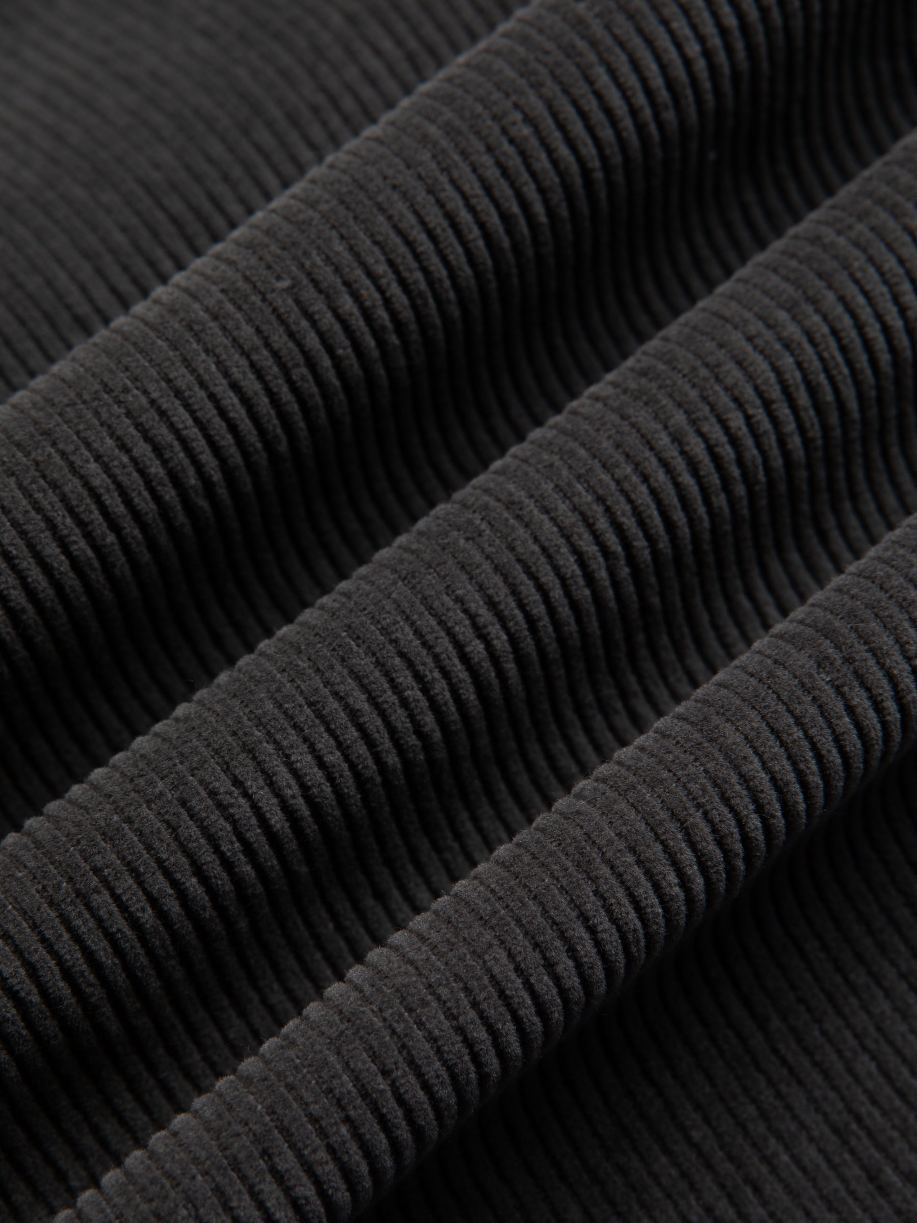 A corduroy fabric in charcoal grey, used to make the KESTIN Rosyth Overshirt.