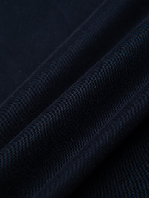 A navy blue cotton twill fabric, used to make a casual men's suit.