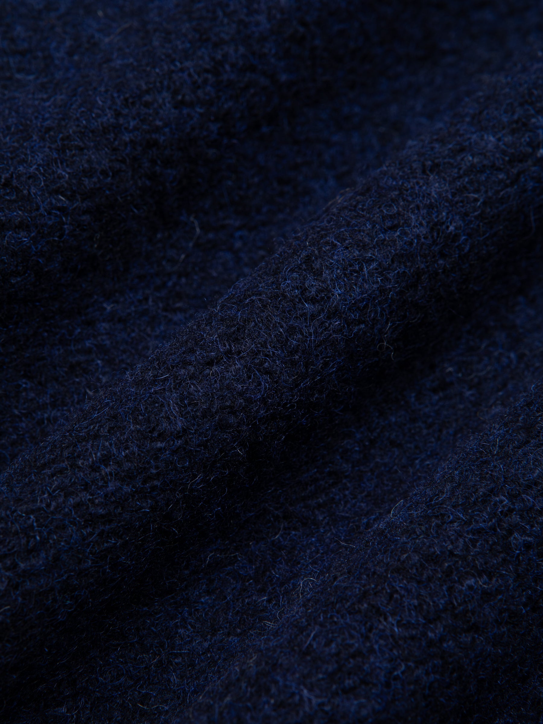 A navy blue fleece fabric used for the AW24 Collection by menswear brand KESTIN.