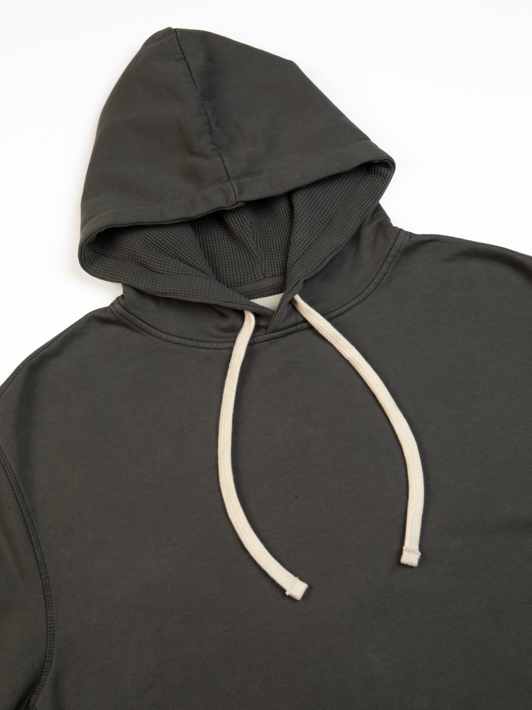 The drawstring hood of the St Andrews Hoodie by Scottish menswear brand KESTIN.