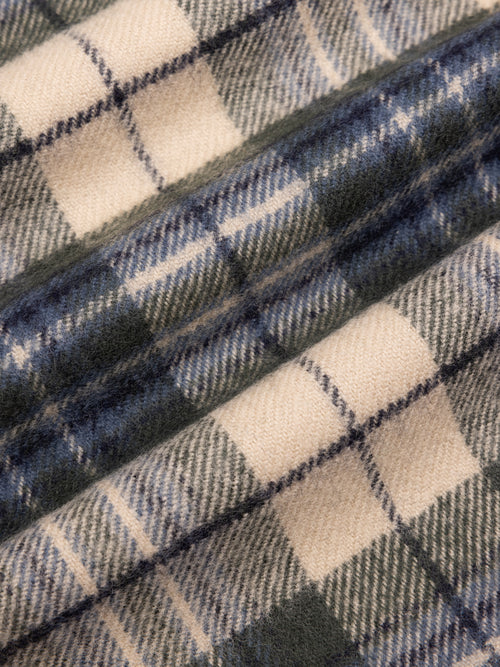 Close-up of plaid fabric with blue and beige colors