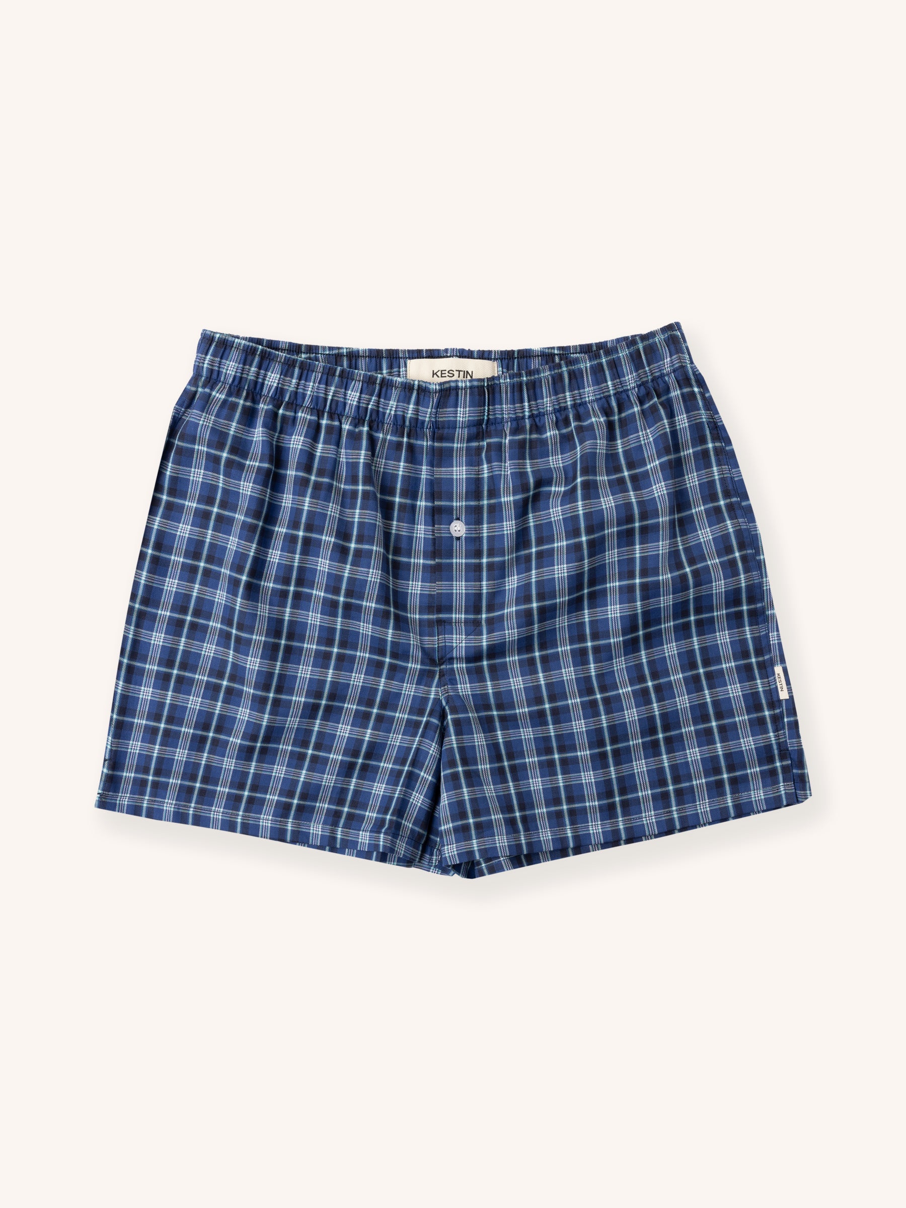 Blue plaid boxer shorts on a white background