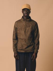A model wearing the KESTIN Crieff Windbreaker in a Brown Camo design.