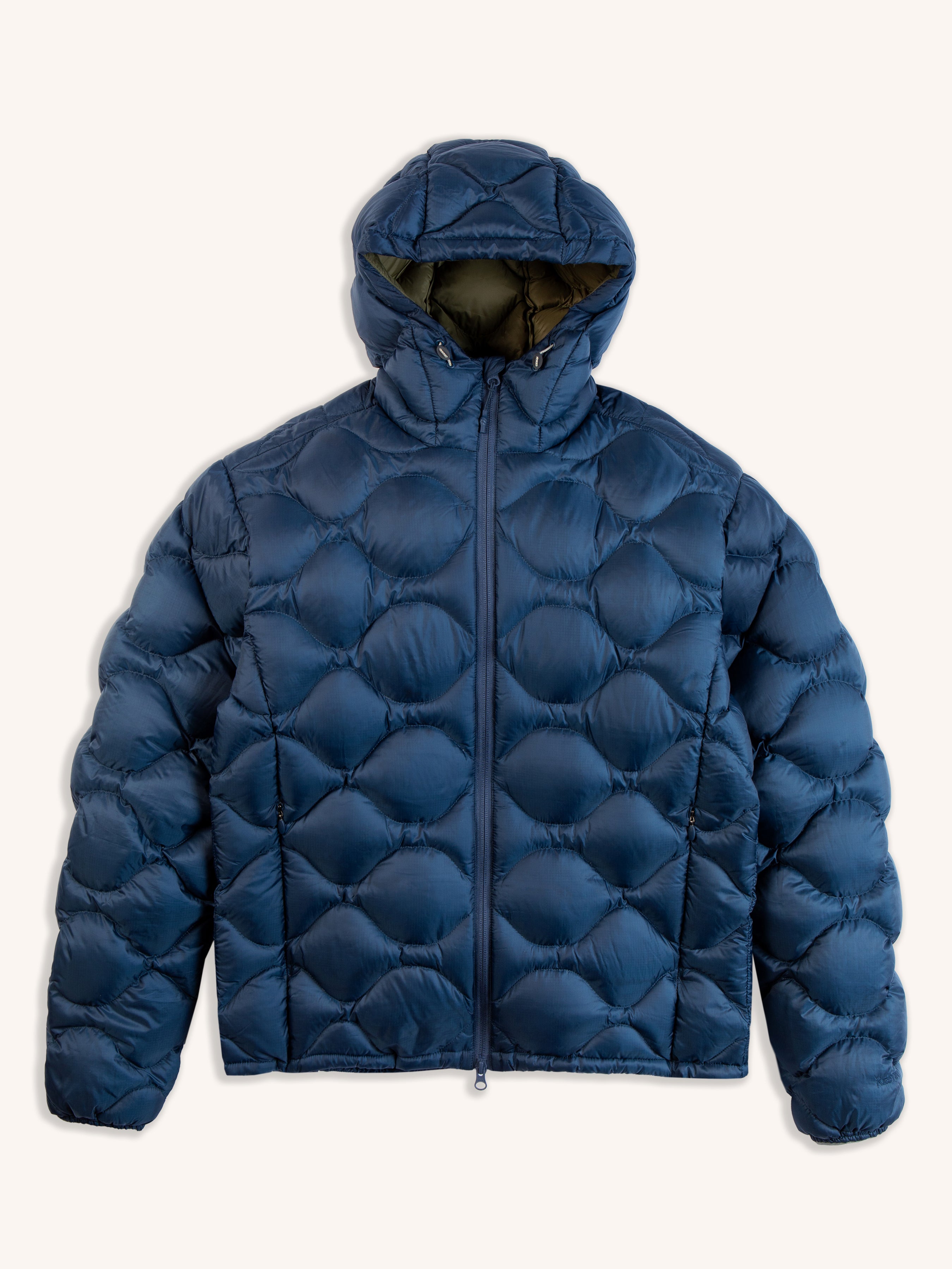A quilted down jacket in petrol blue by men's clothing brand KESTIN on a white background.