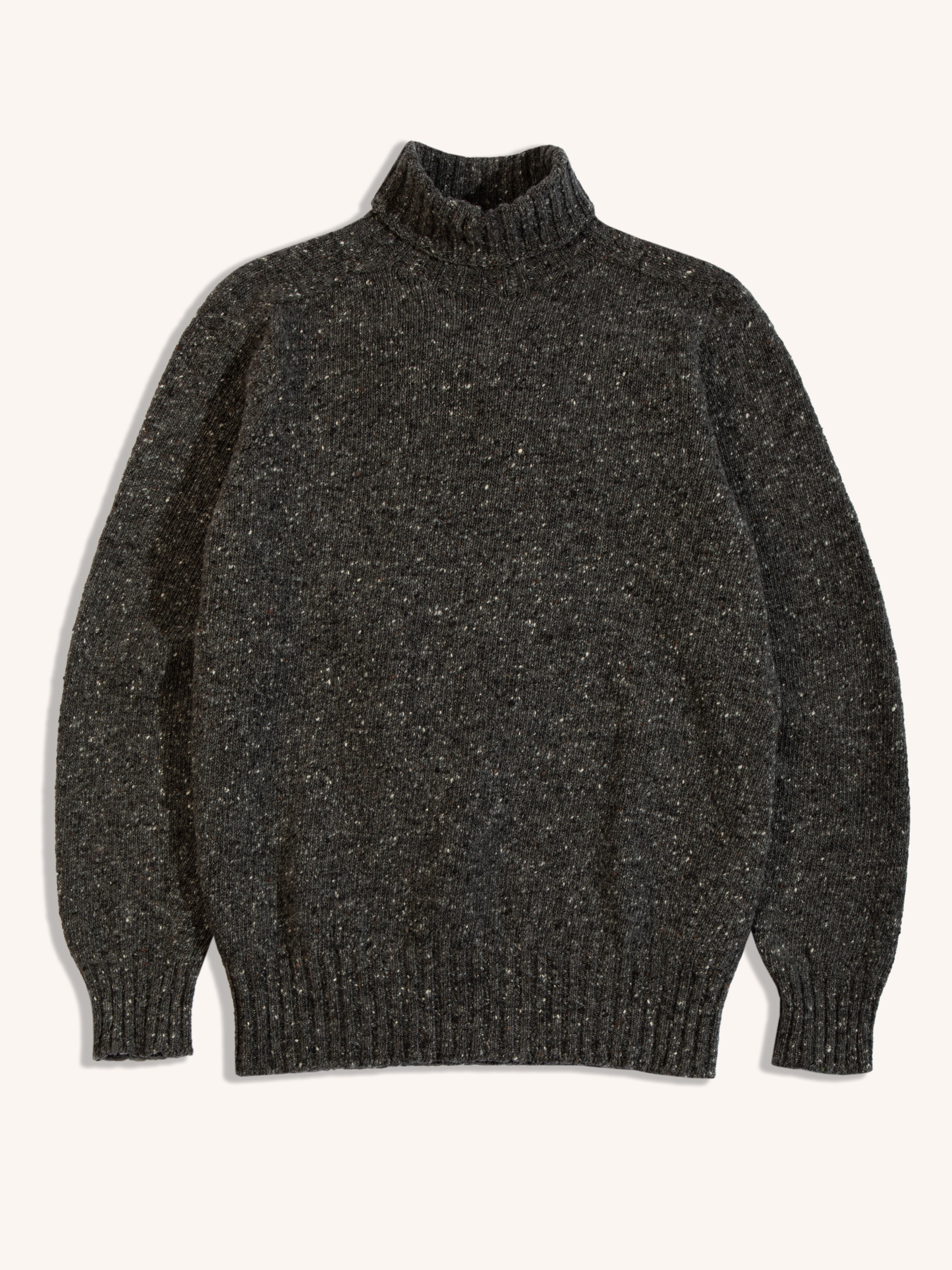 A charcoal grey sweater from menswear brand KESTIN, made from Donegal wool.