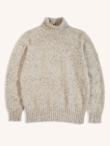 A knitted roll neck sweater in a natural grey Donegal wool, on a white background.
