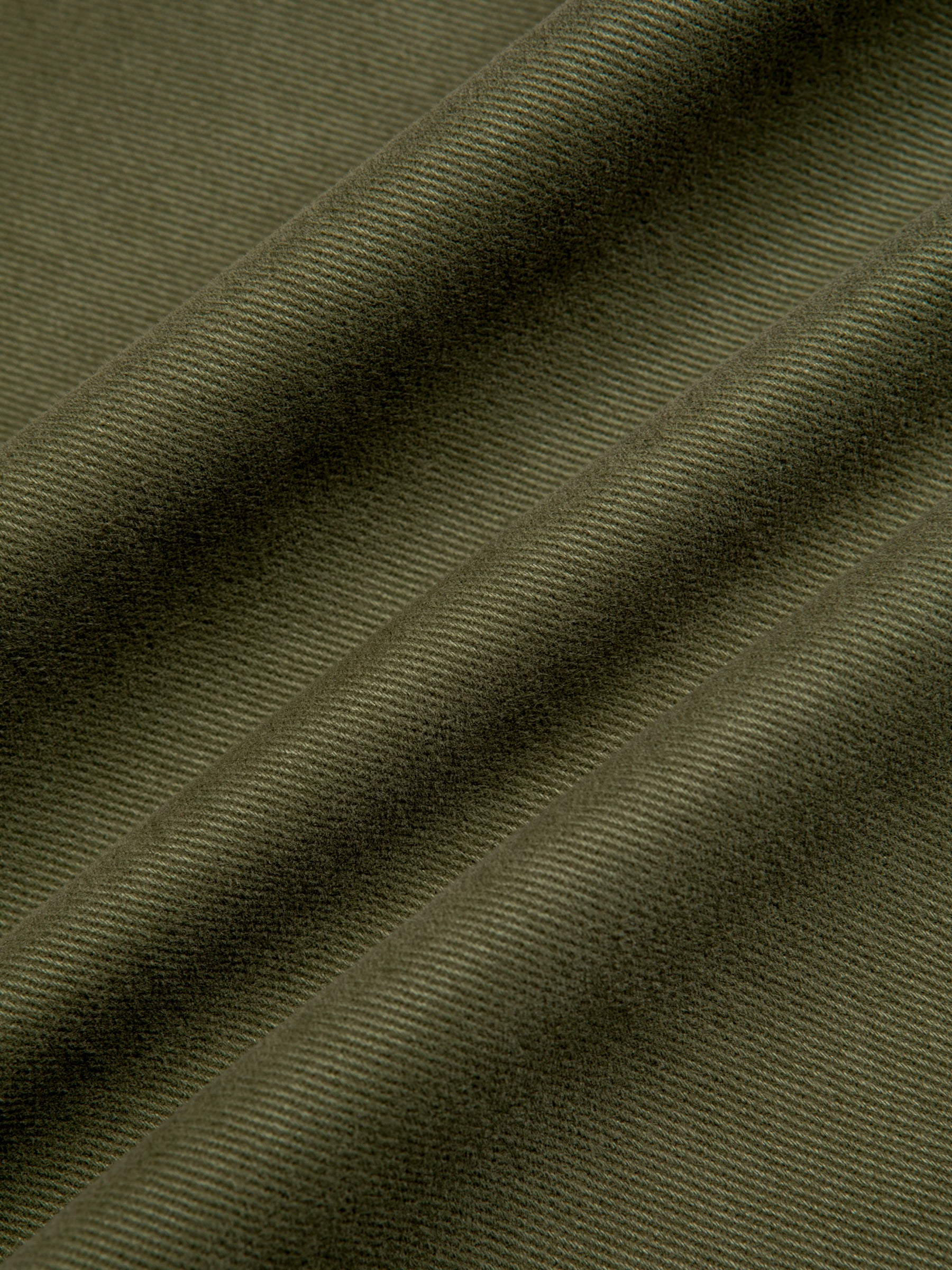 An olive green twill fabric used to make the KESTIN Doune Pant.