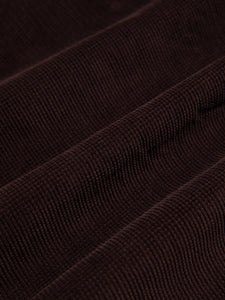 A waffle corduroy material in a dark brown colour, used by KESTIN for their AW23 collection.