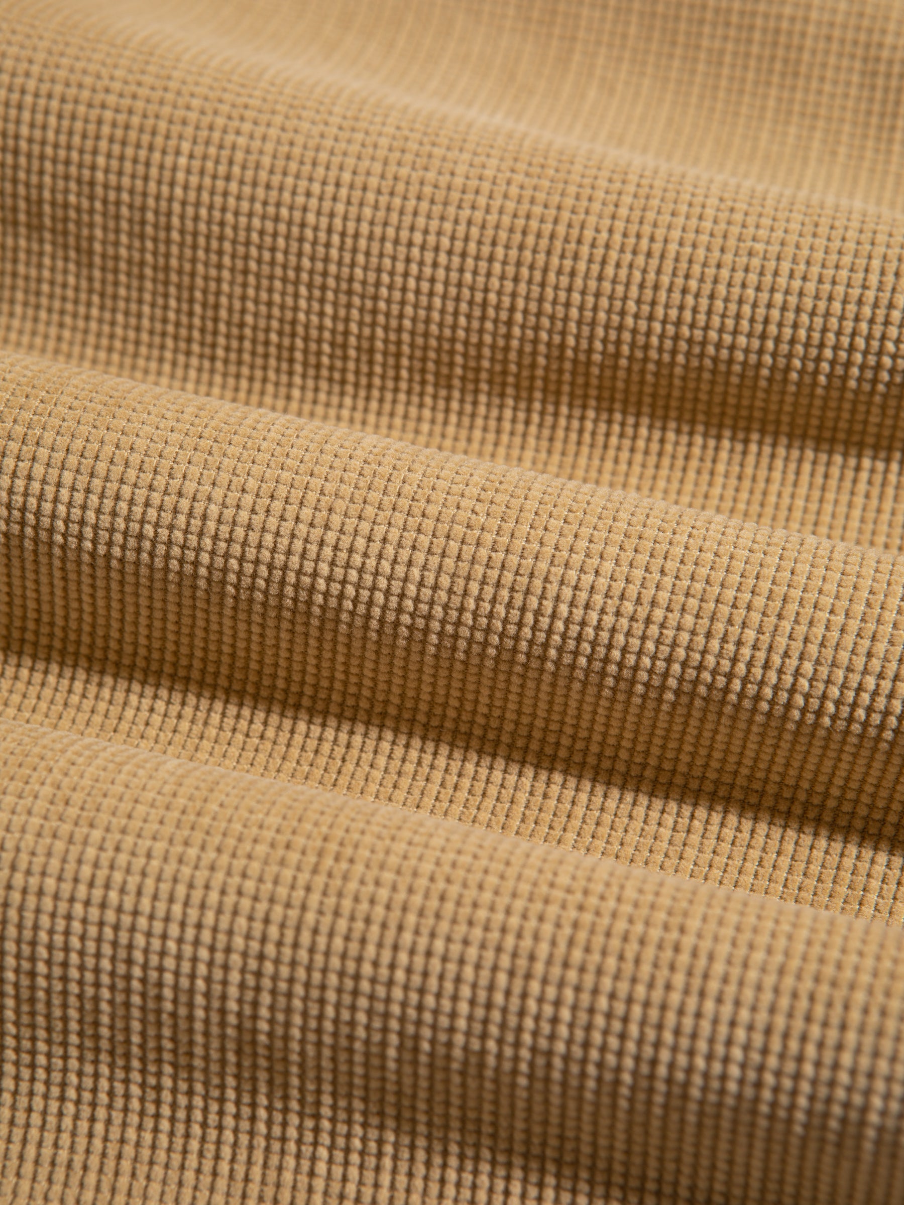A beige corduroy fabric, used by KESTIN to make the AW23 Huntly Suit.