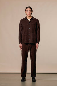 A model wearing the Huntly Suit by KESTIN, in a dark brown waffle corduroy.