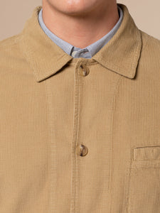 The collar of a smart men's chore coat, made from a classic waffle corduroy.