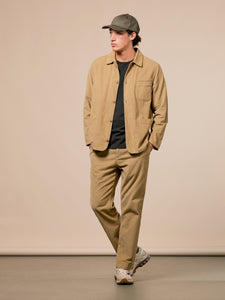A model wearing the Huntly Suit by KESTIN, in a tan brown/beige corduroy material.