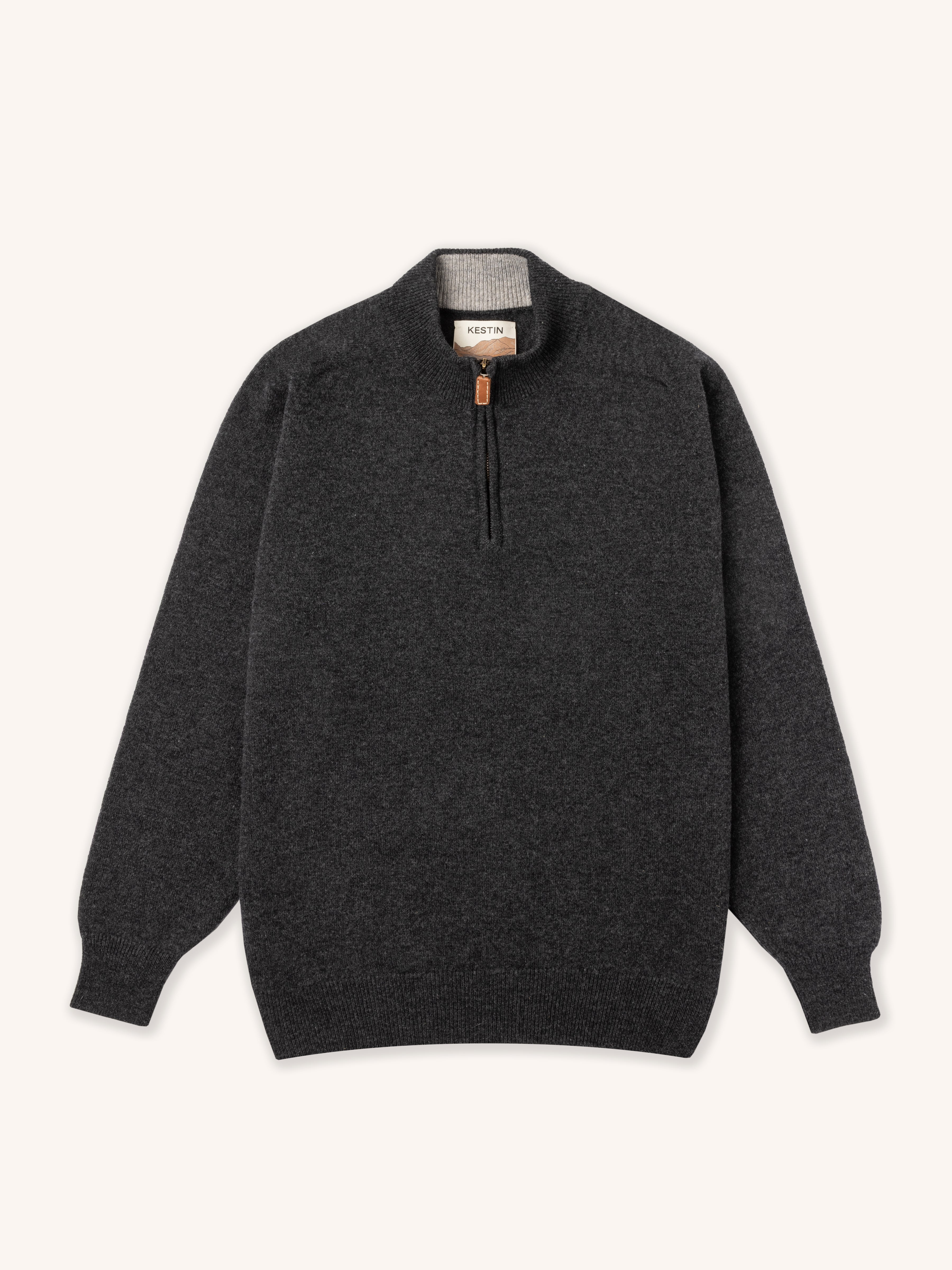 Dark gray sweater with a quarter zip on a white background