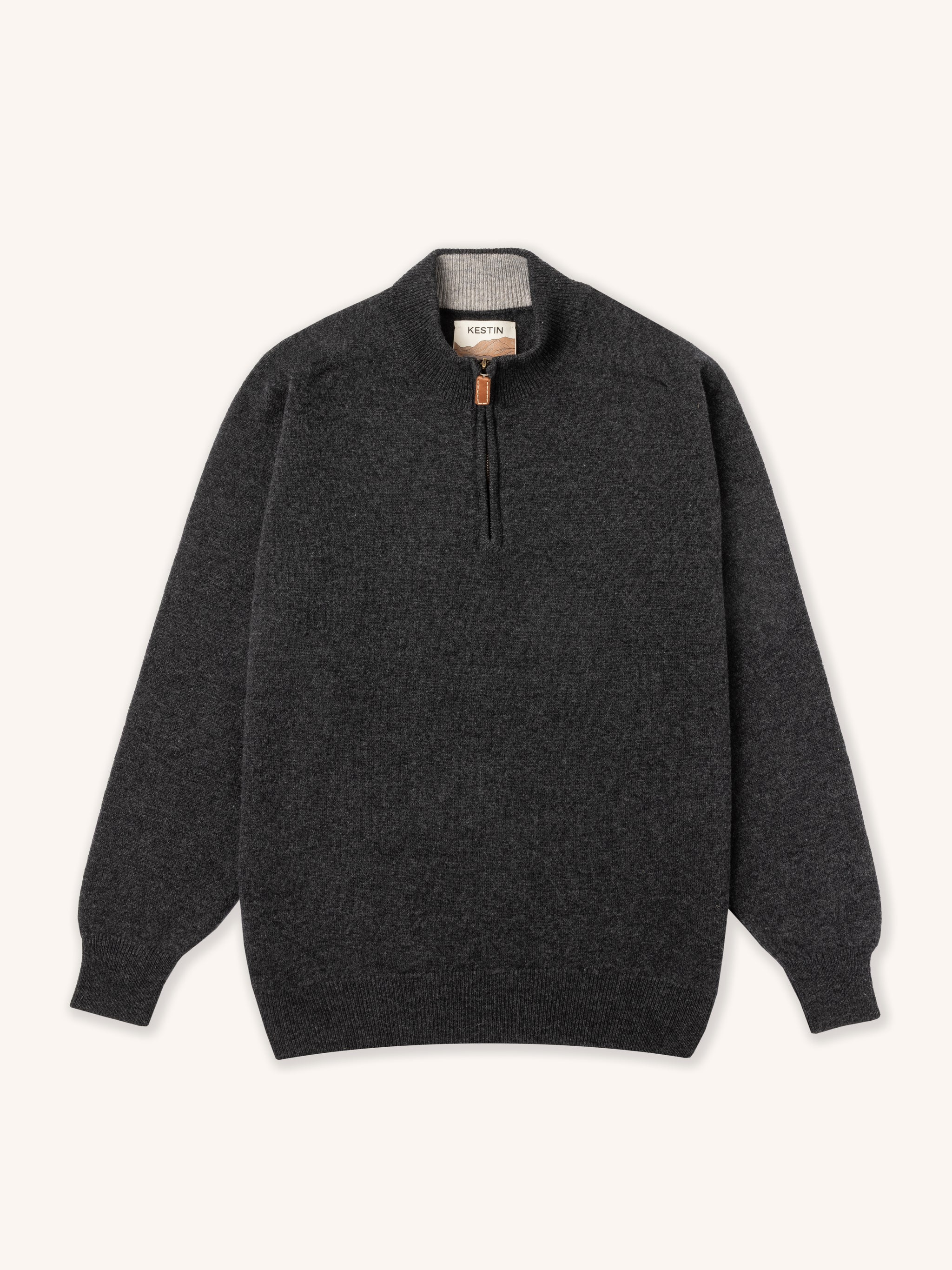 Dark gray sweater with a quarter zip on a white background