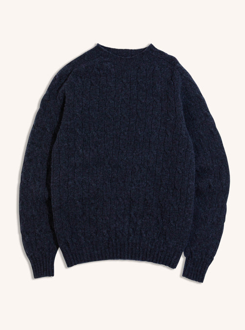 A men's Cable Knit Shetland Wool Sweater in blue on a white background.