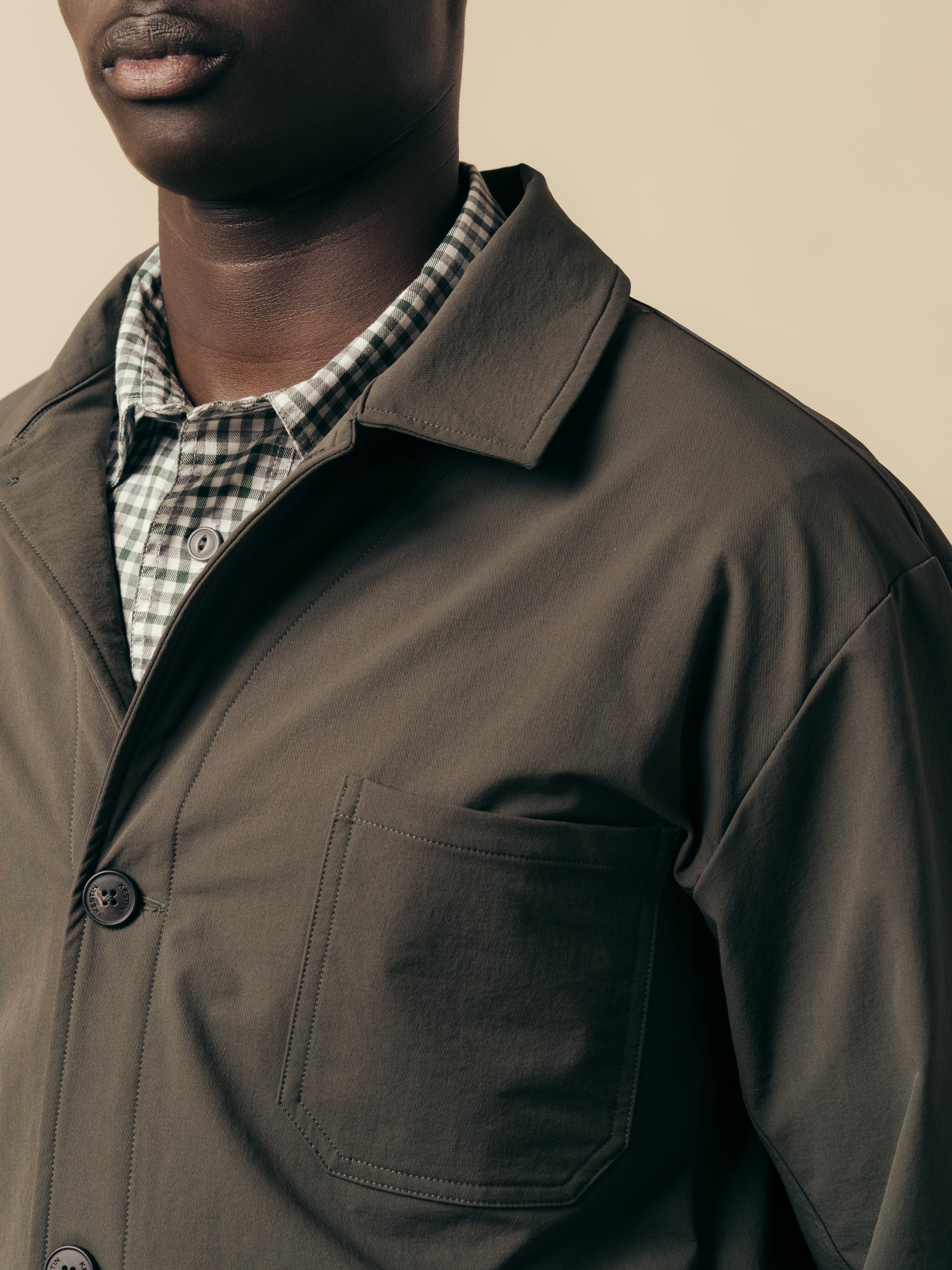 The chest pocket and lapel of the KESTIN Port Jacket in Slate.