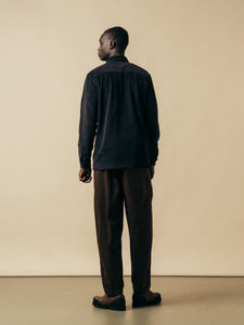A man facing away wearing autumn/winter clothing from KESTIN.