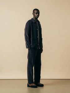 A man wearing a black moleskin suit from Scottish menswear designer KESTIN.