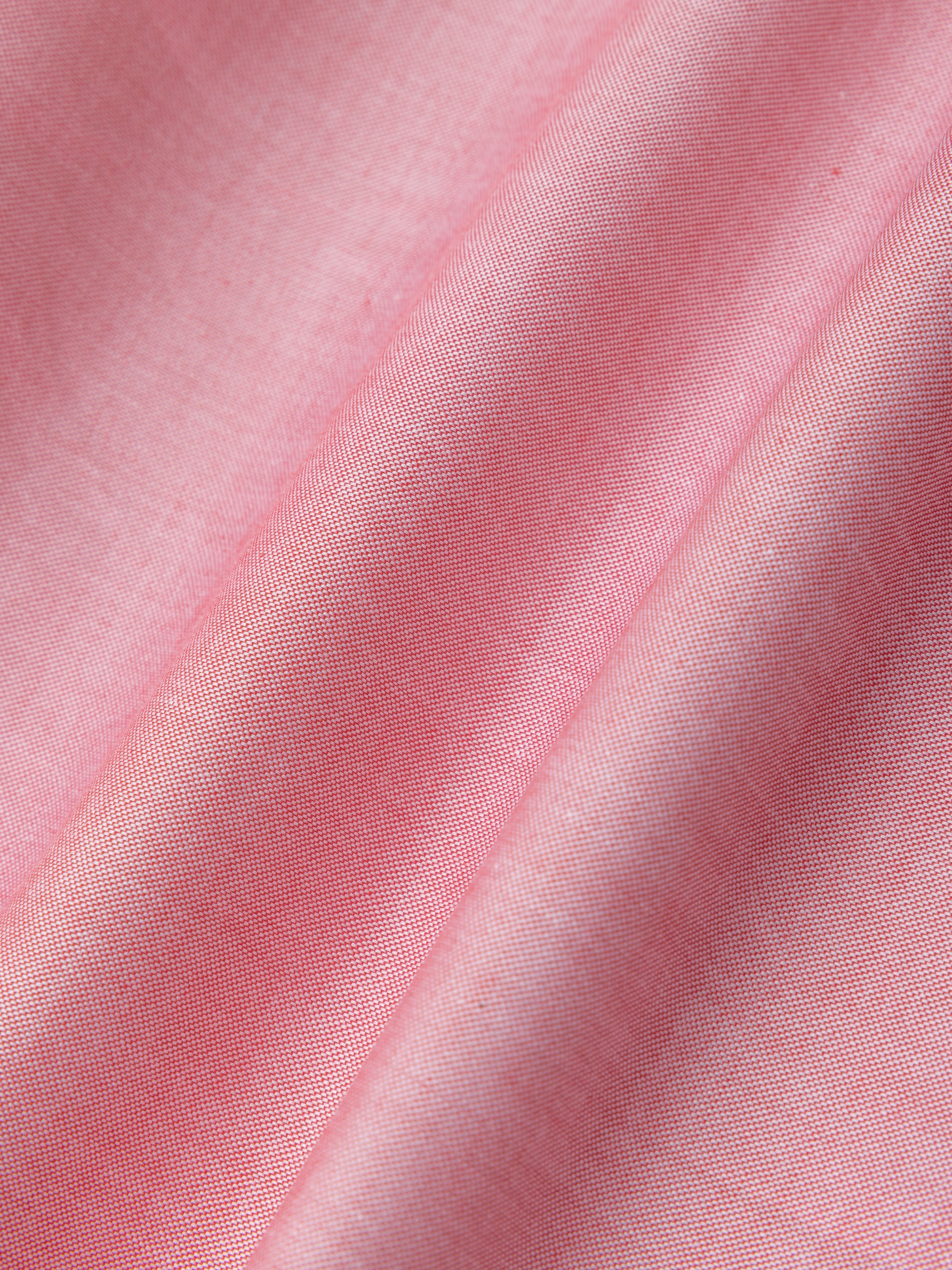 Close-up of lightweight pink shirt fabric