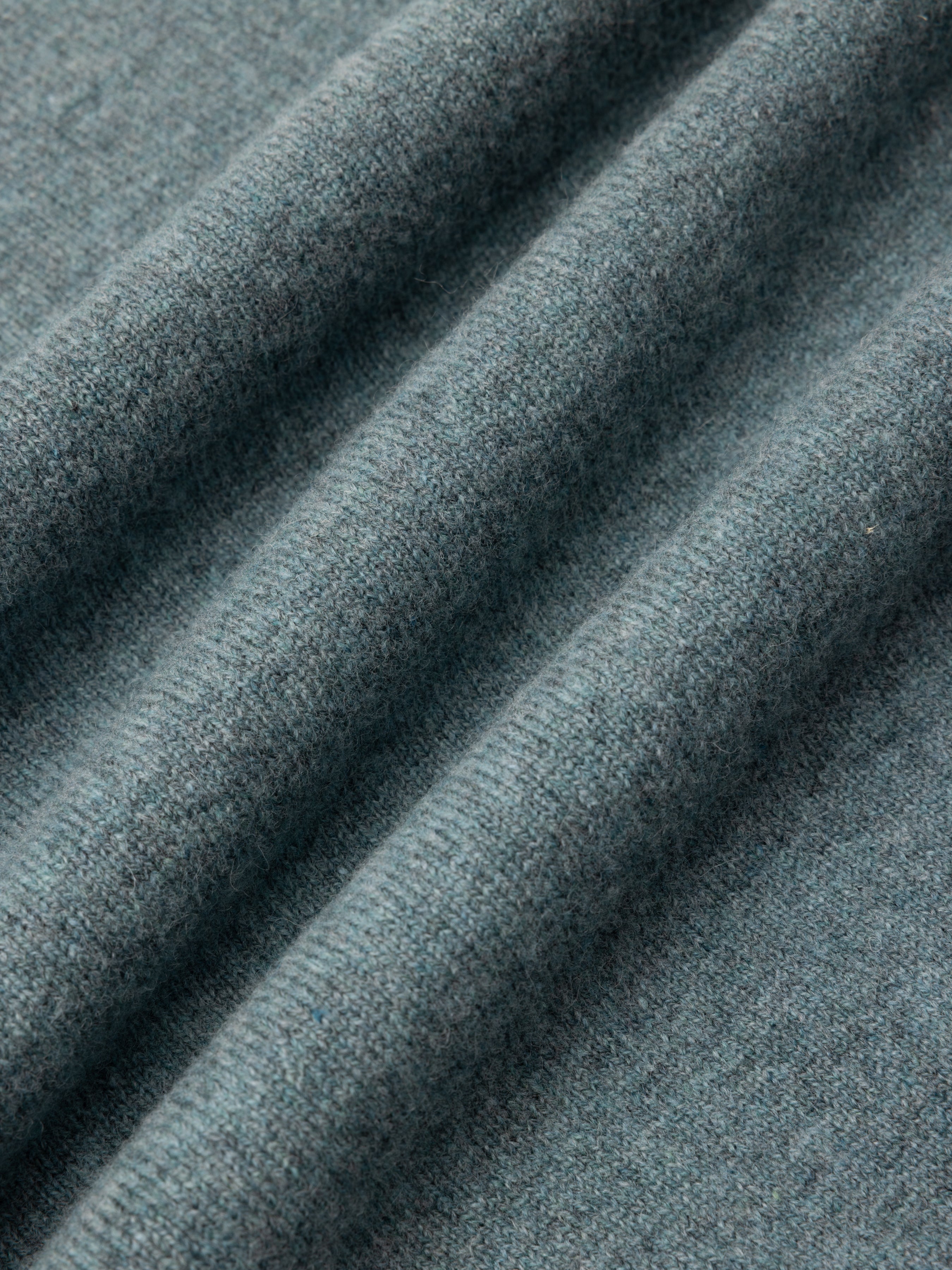 Close-up of textured teal lambswool fine gauge fabric