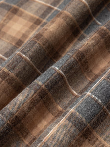 Close-up of plaid fabric with brown and gray colors