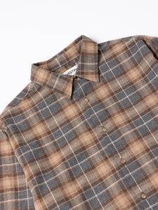 Plaid shirt with brown and blue pattern on a white background