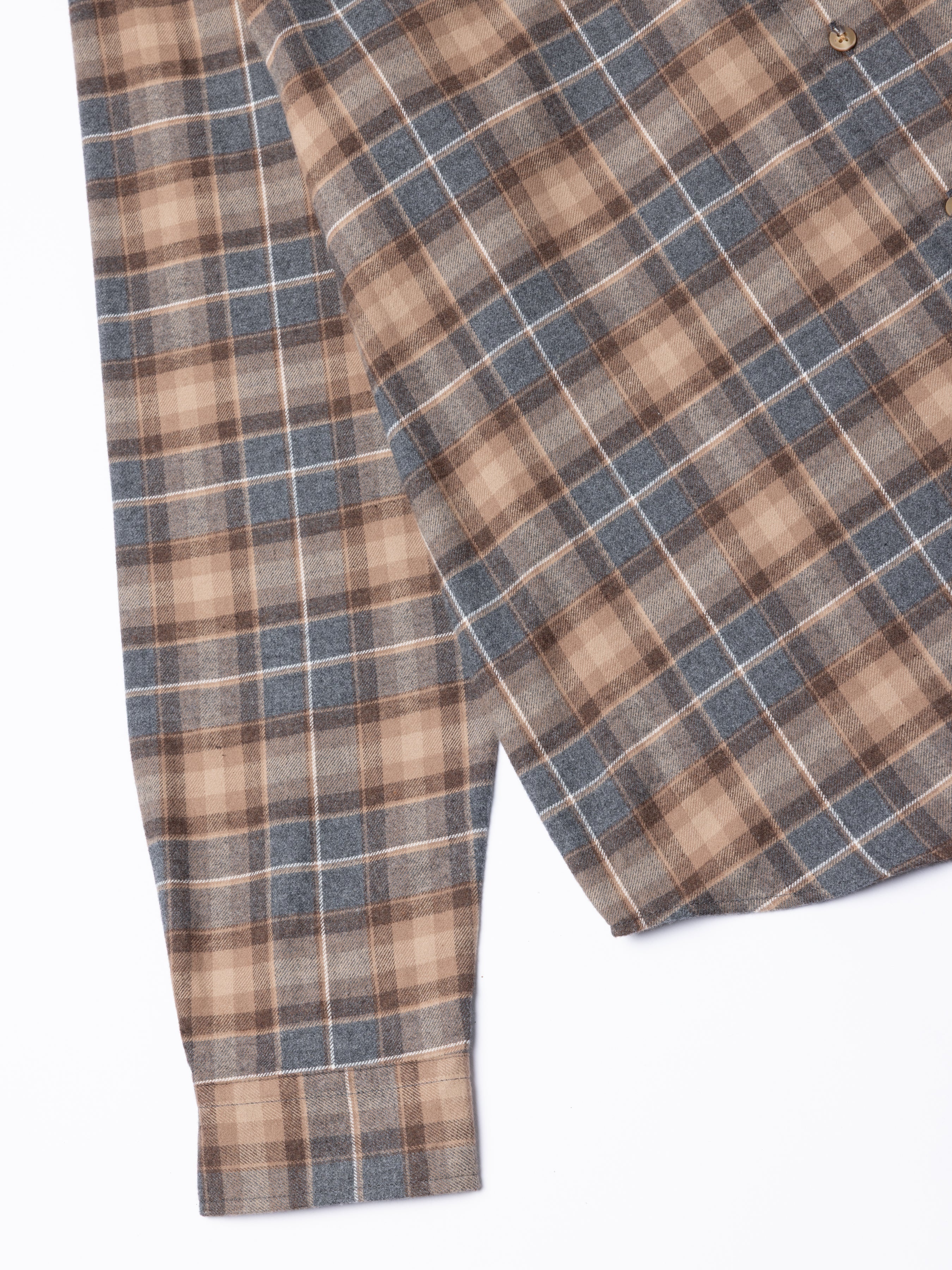 Plaid shirt with brown and grey check pattern on a white background