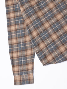 Plaid shirt with brown and grey check pattern on a white background