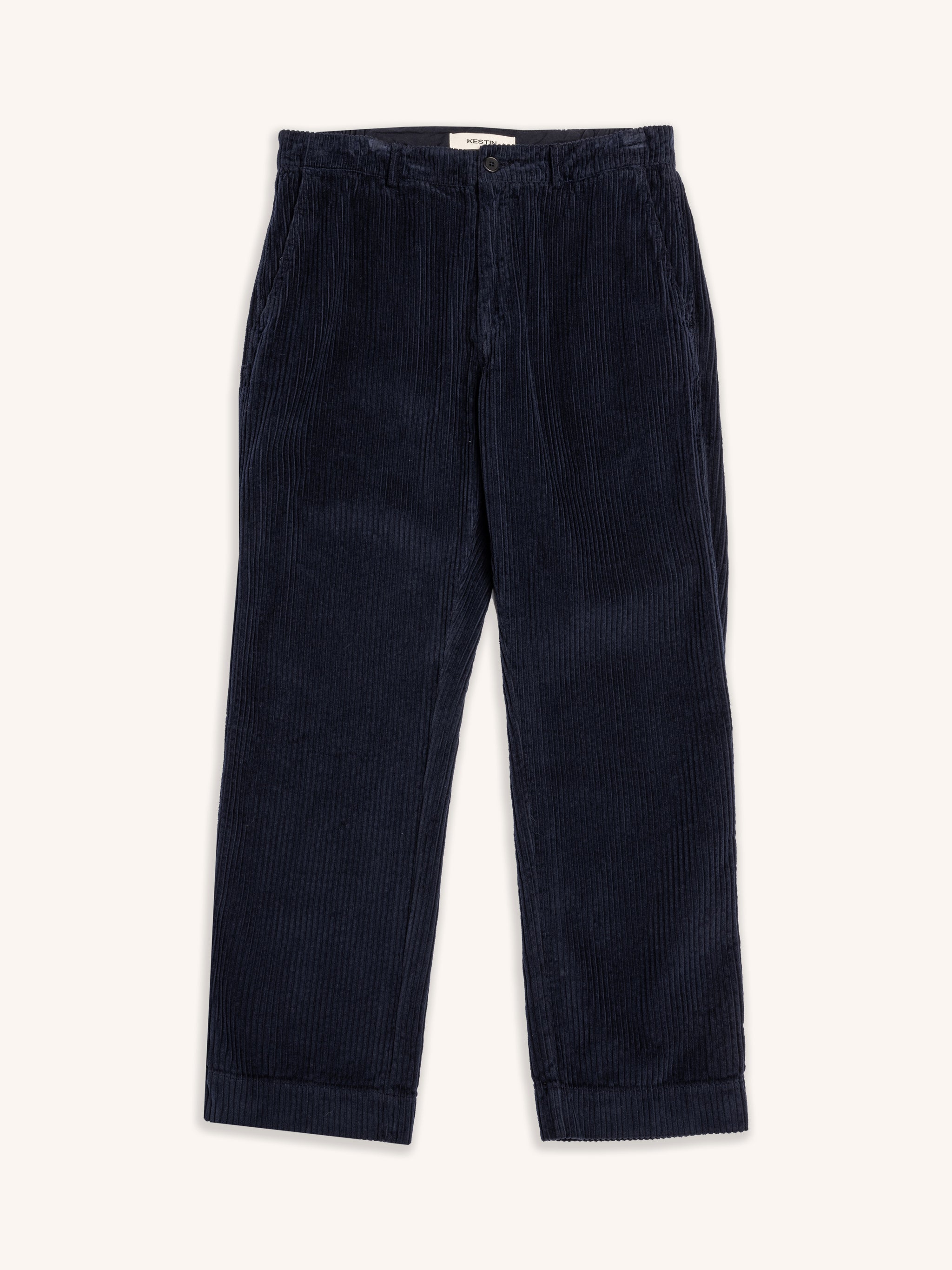 Navy blue corduroy pants on a white background