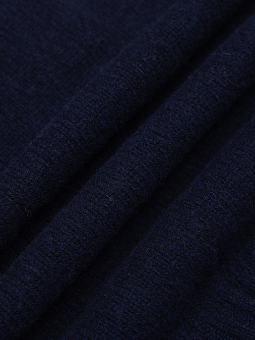 A navy blue shetland lambswool yarn, used to make Scottish knitwear.